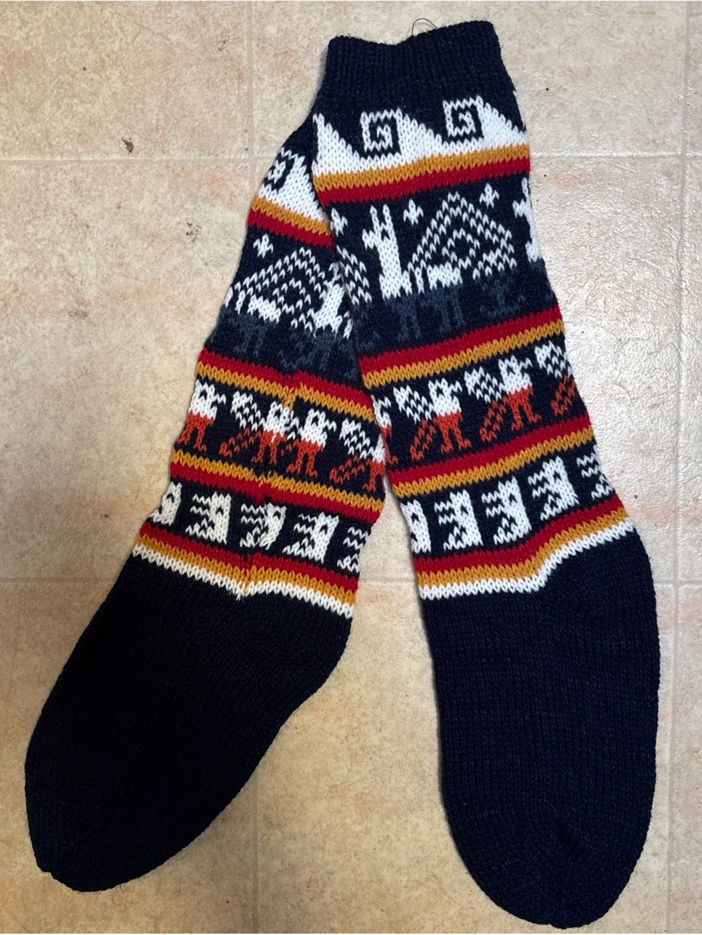 Womens handknit winter slipper socks made with alpaca wool with geometric animal